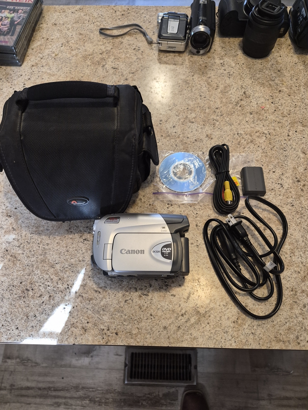 Canon Model # DC-320 Silver DVD Camcorder with Accessories